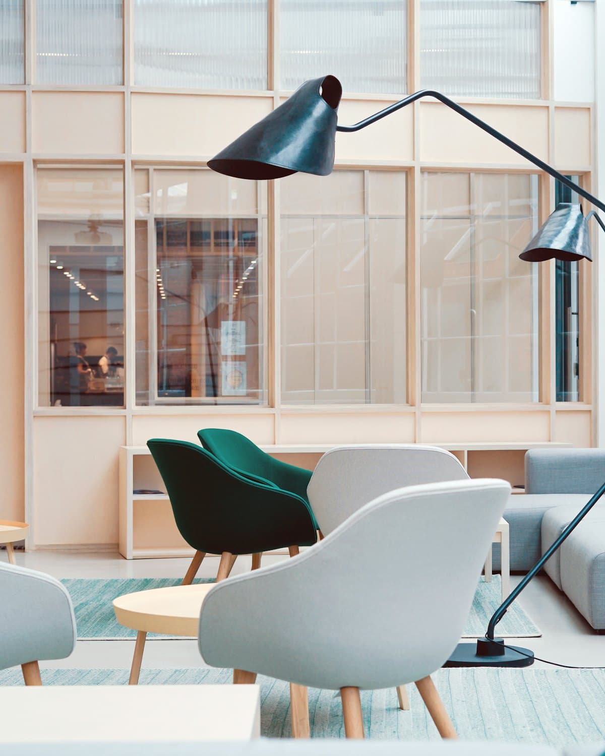 A quiet, daylit consulting room with soft seating