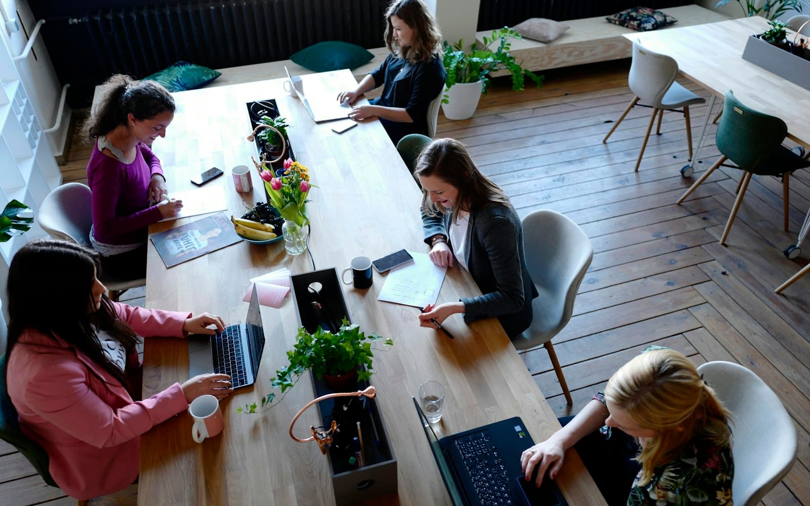 A shared table seen from above during a working session